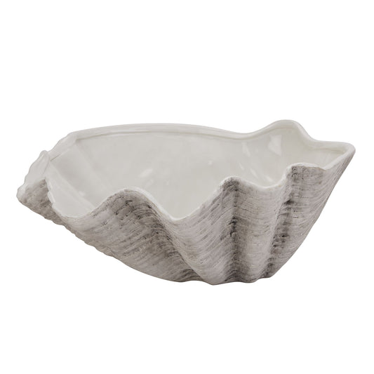 White ceramic shell-shaped bowl on a white background