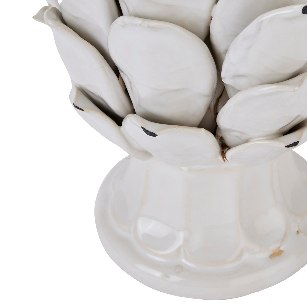 White ceramic artichoke ornament closeup