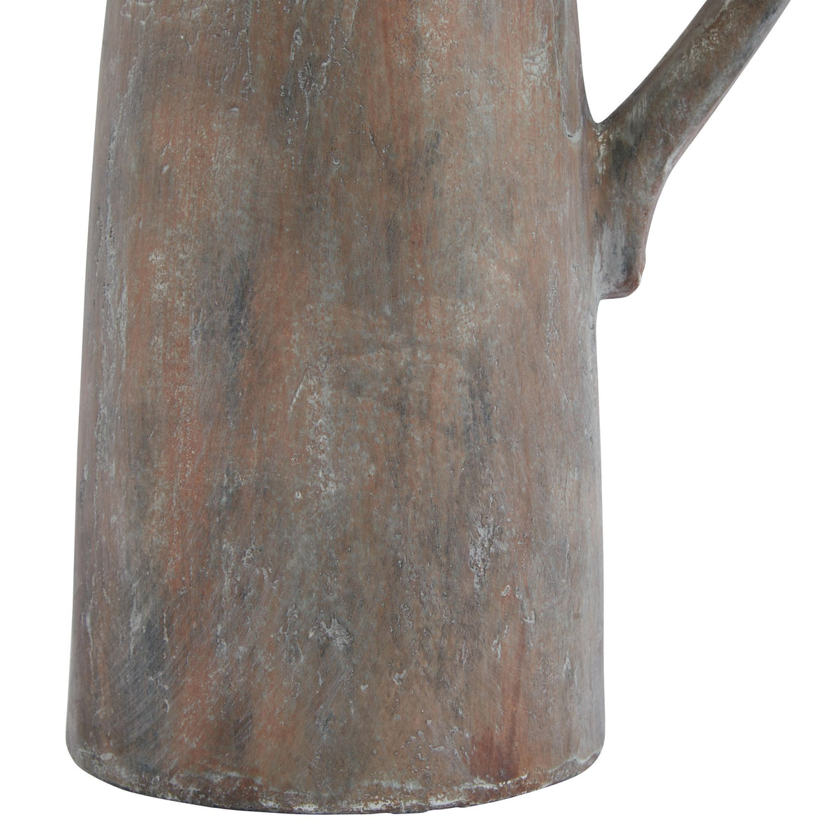 Close-up of a textured metal pitcher on a white background