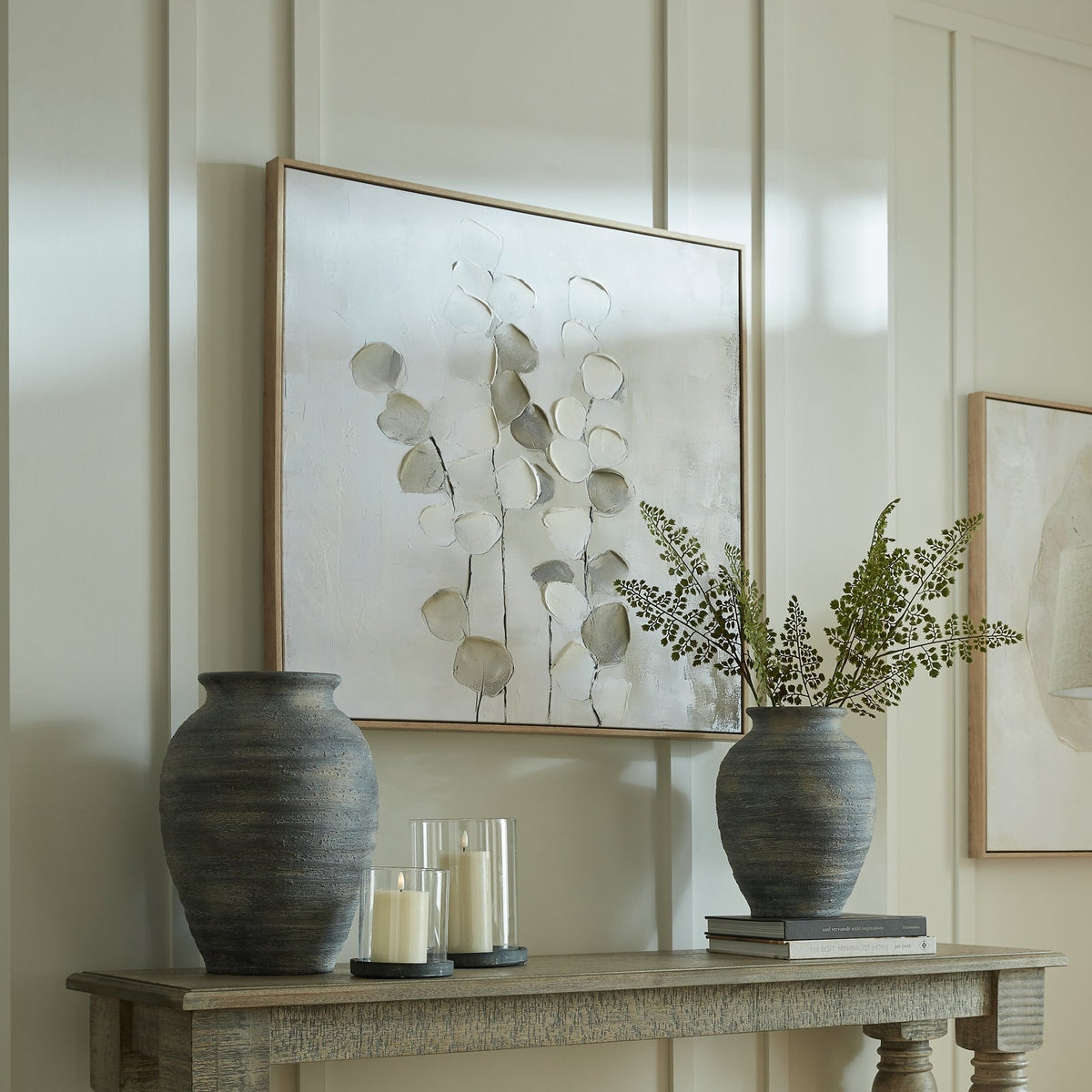 neutral canvas framed art above sofa