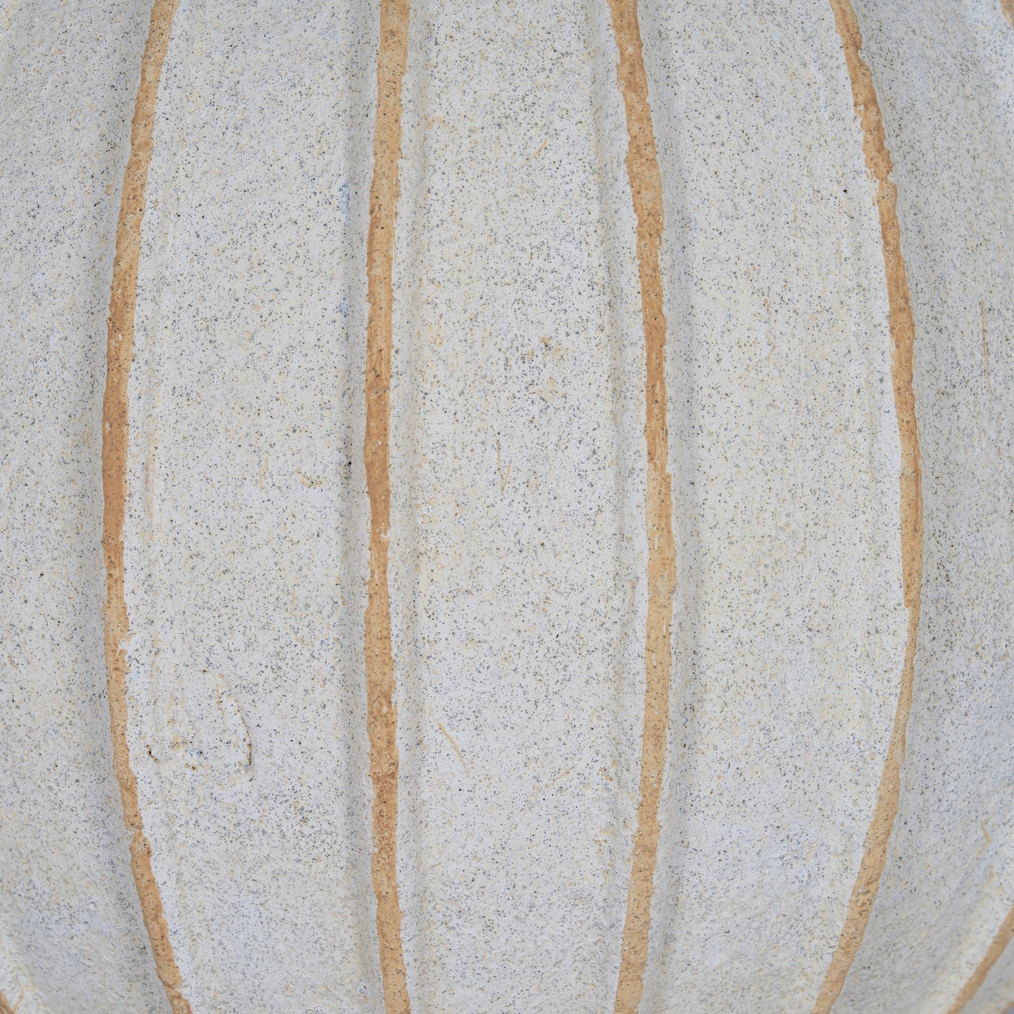 Close-up of a textured surface with beige lines