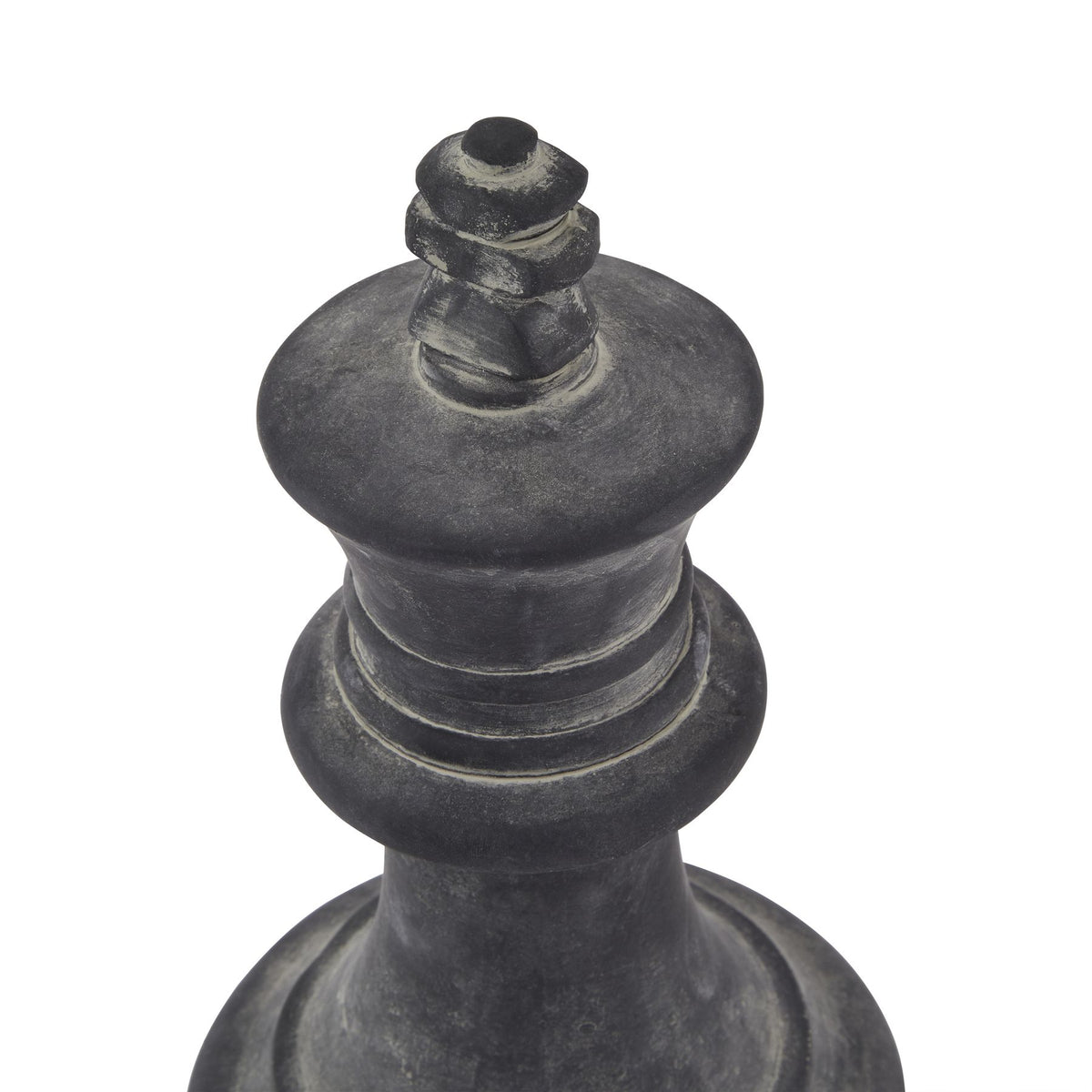 Black chess piece, likely a king, on a white background
