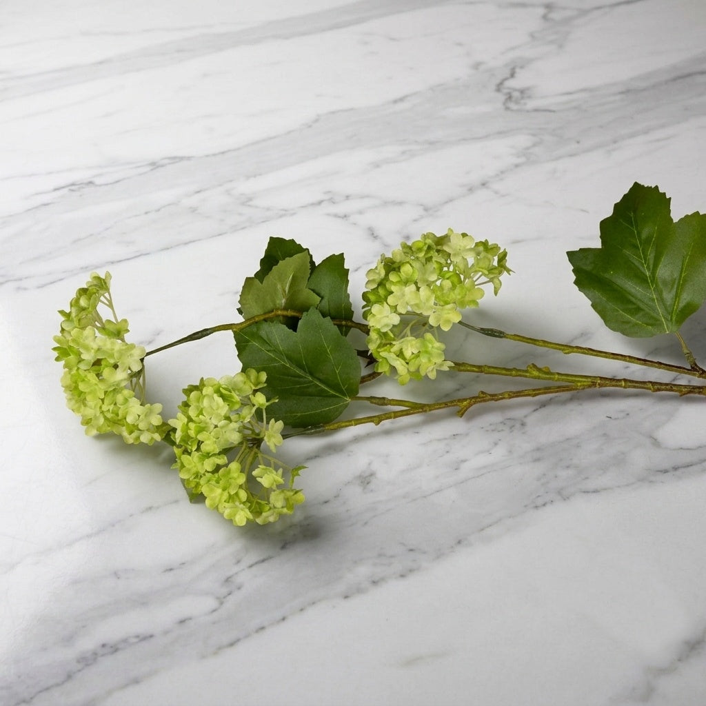 Green floral flowers on a marble surface