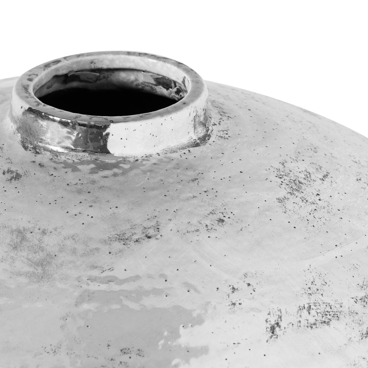 Close-up of a textured silver ceramic vase on a white background