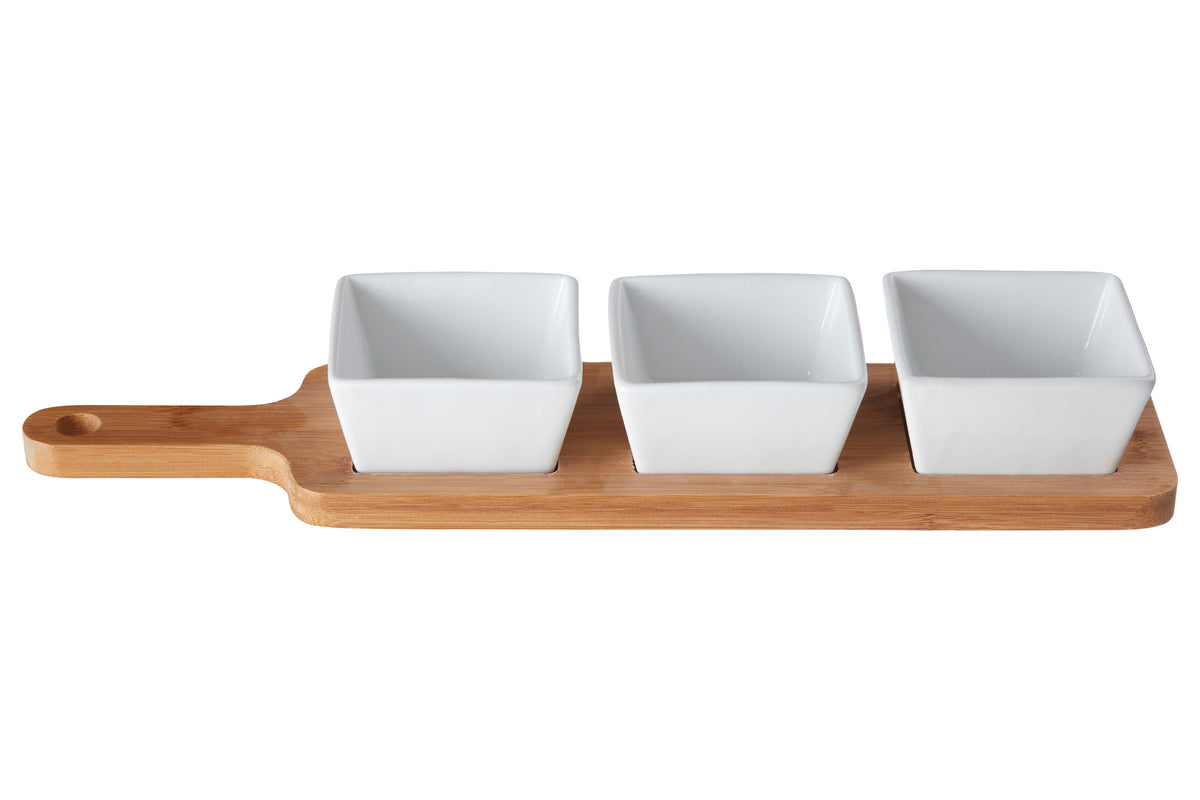 Three white square tapas bowls on a wooden tray against a white background
